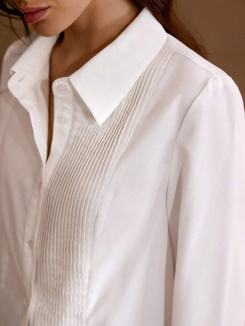 Camisa elegante y versátil panel plisado