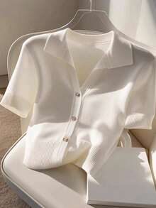 Blusa polo de punto fino con botones manga corta