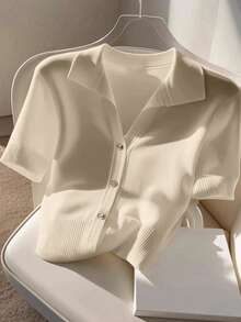Blusa polo de punto fino con botones manga corta
